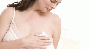 Выделения из груди перед месячными: причины